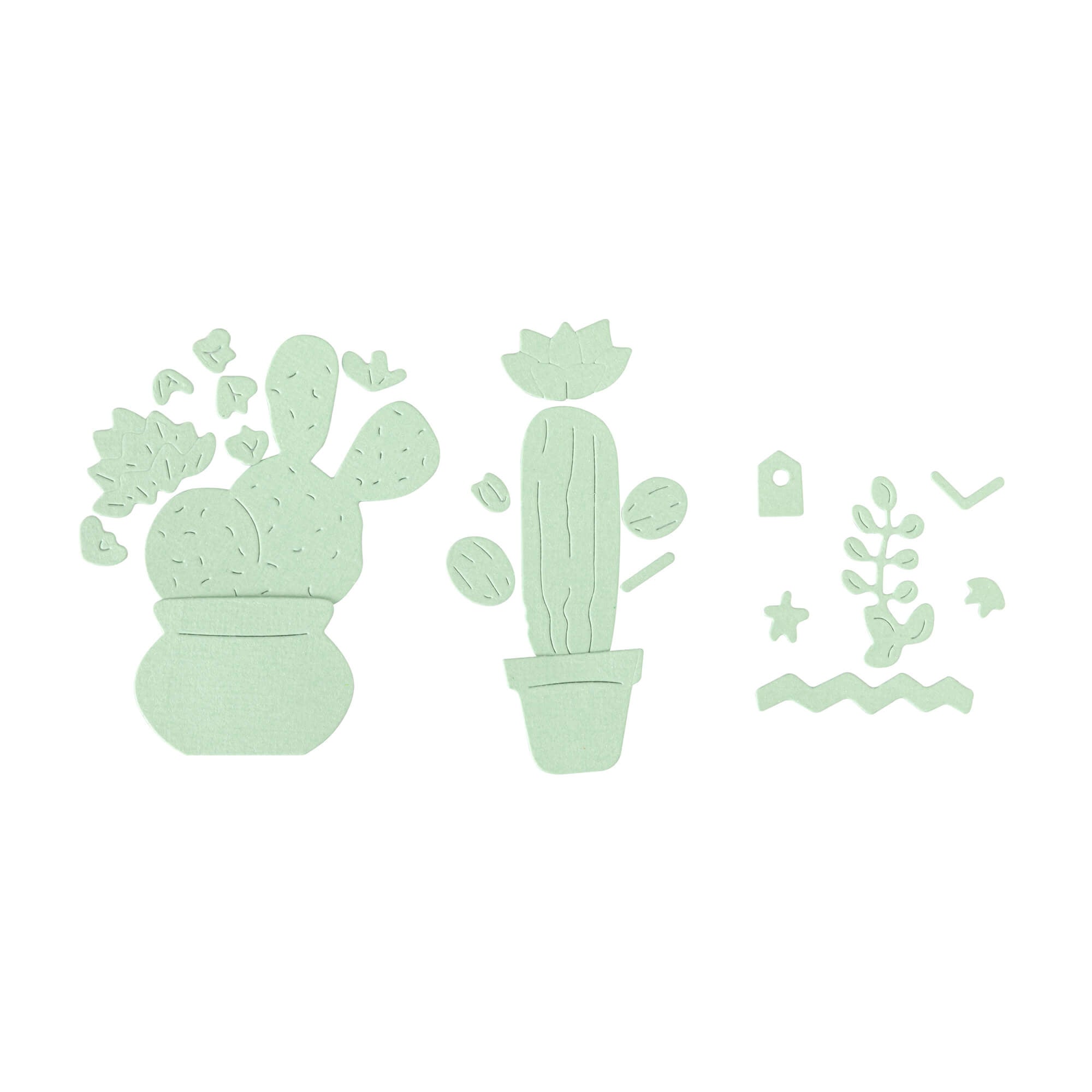 Drei flache, grüne Kaktusformen, die mit dem Stanzschablone Kakteenset von Stanzenshop.de erstellt wurden, plus zusätzliche dekorative Pflanzen - perfekte Akzente für Scrapbooking - auf weißem Hintergrund arrangiert.