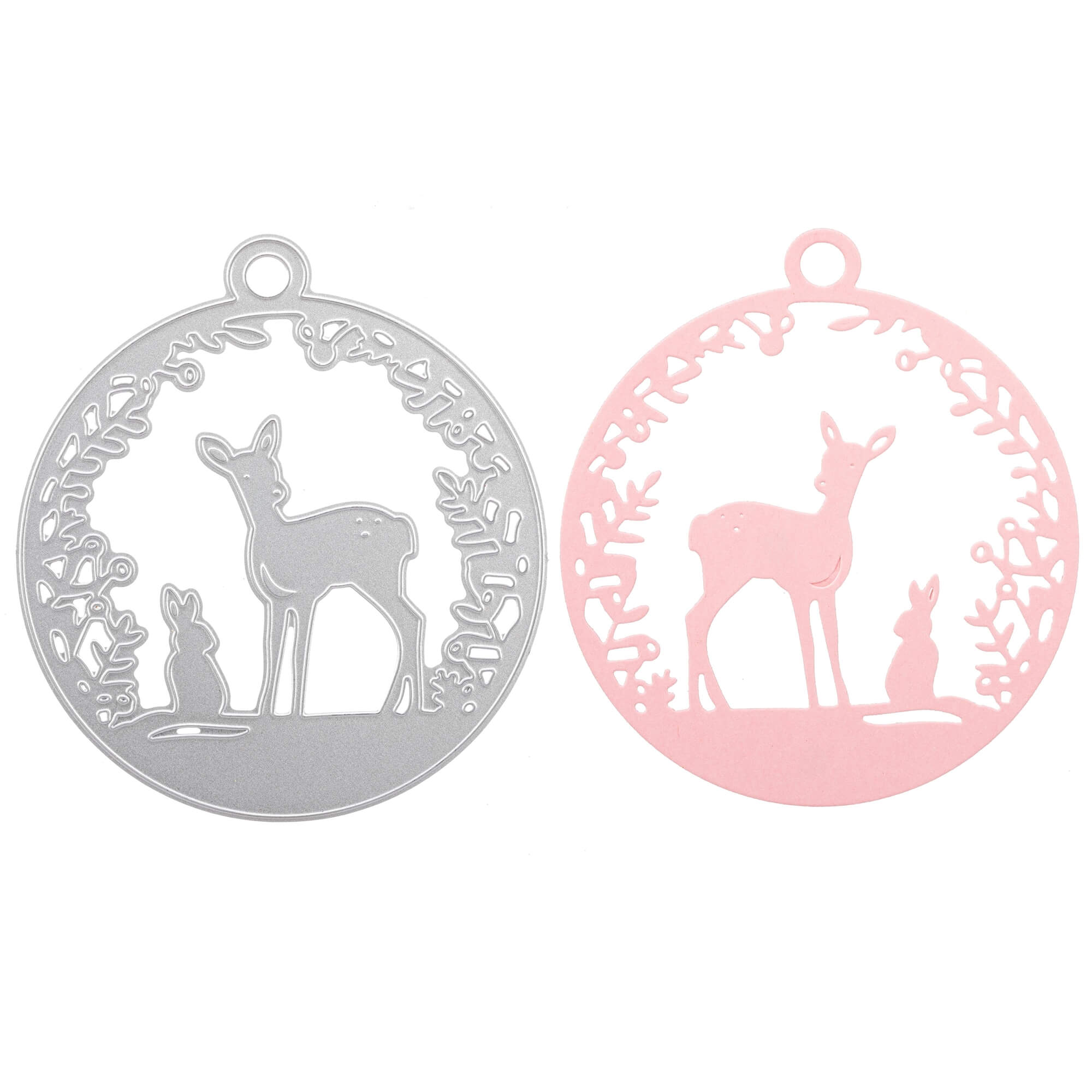 Zwei runde Ornamente - eins in Silber, eins in Rosa - zieren die Stanzenshop.de Stanzschablone: Reh mit Hase Ausschnitt mit Blattwerk. Ideal für Bastelprojekte oder Scrapbooking-Akzente.