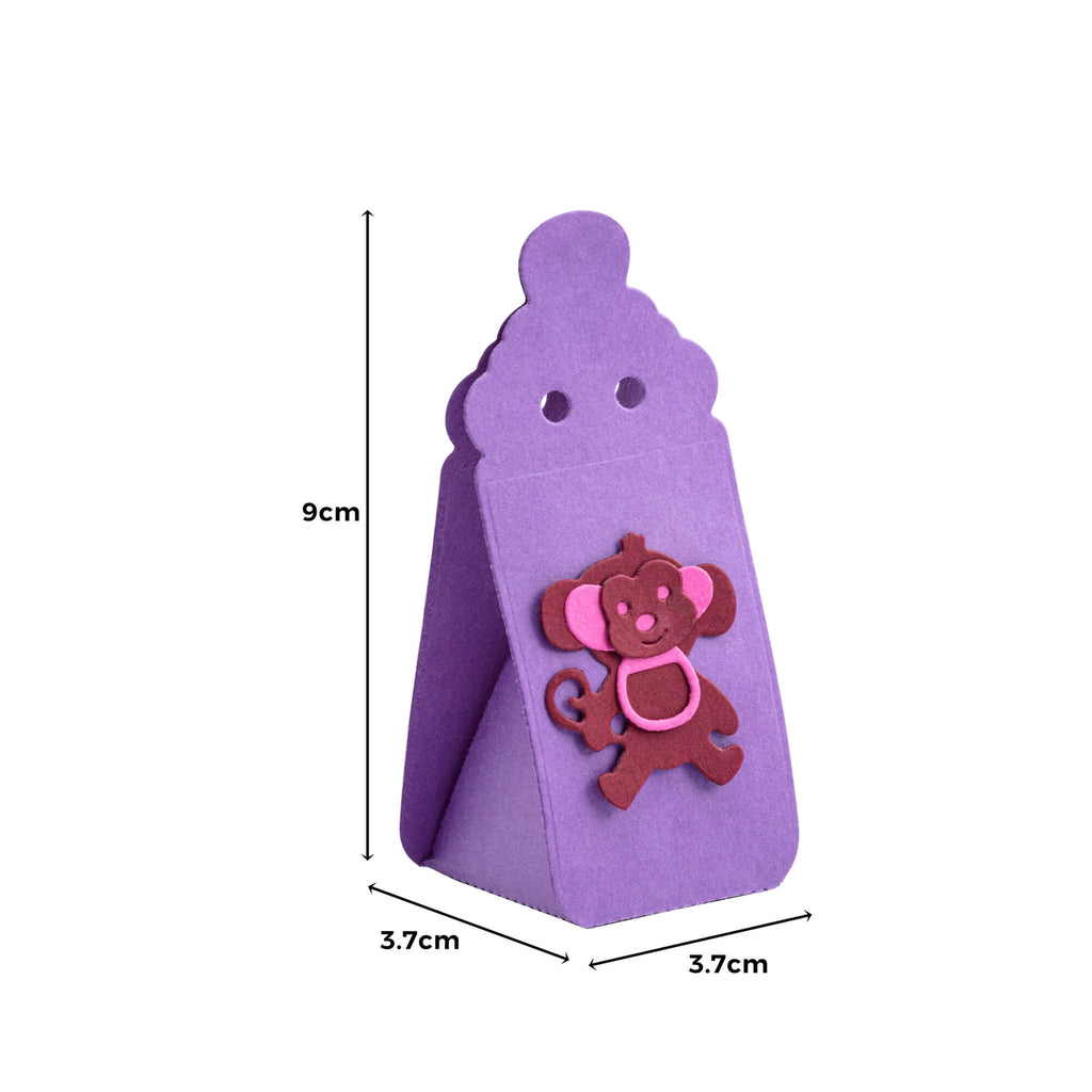 Eine lila Stanzschablone Babyflaschen-Aufsteller-Geschenkbox mit einem rosa Affen darauf und einem Stanzen-Muster als Aufsteller von Stanzenshop.de.