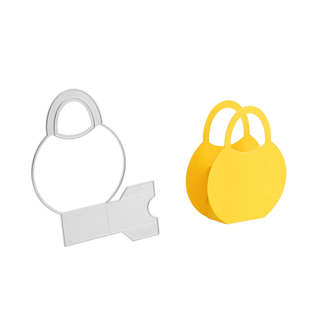 Ein Stanzenshop.de gelbes Stanzschablone Bastelset Handtasche und eine weiße Tasche auf einer weißen Fläche.