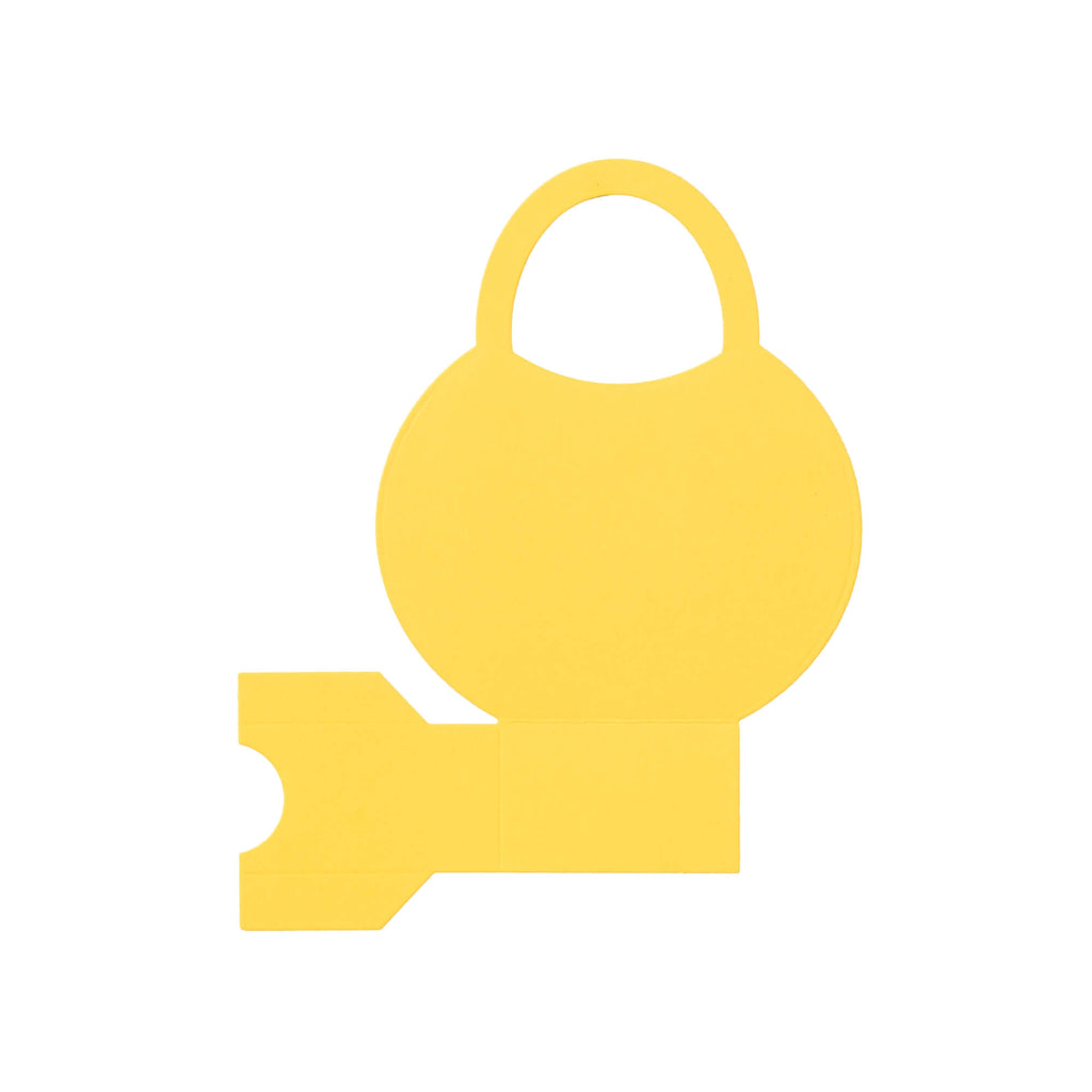 Ein gelber Schlüssel auf weißem Hintergrund in einem Stanzschablone Bastelset Handtasche von Stanzenshop.de.
