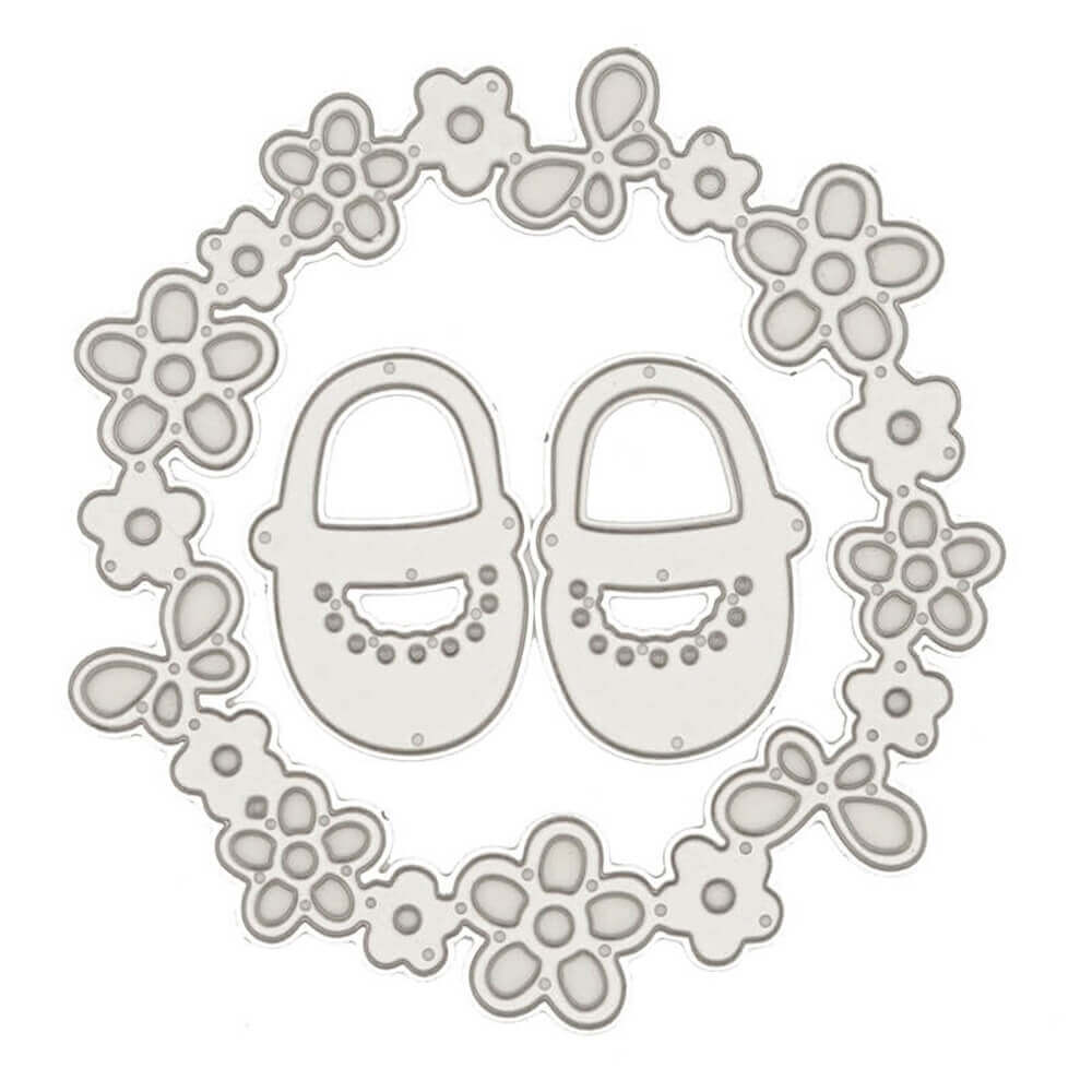Ein Paar Stanzschablone Babyschuhe im Blütenkranz, erstellt mit einer Stanzschablone (Stanzvorlage) und Stanzen (Stanztechnik) von Stanzenshop.de.