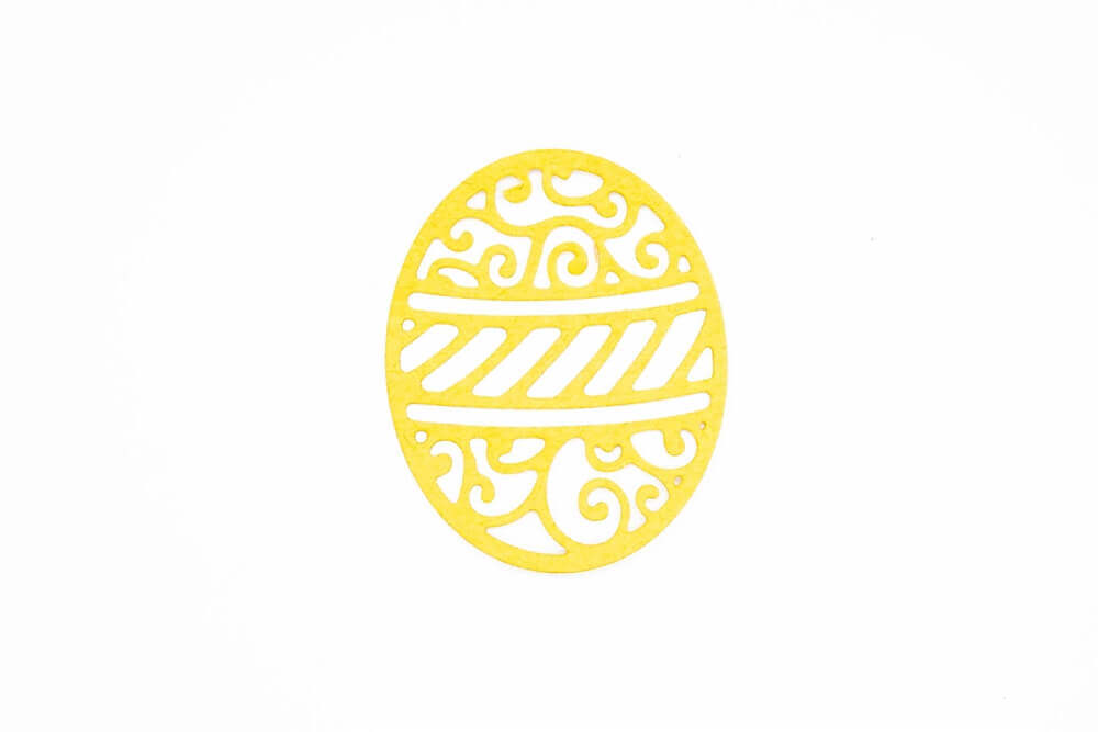 Eine gelbe Stanzschablone: Osterei mit drei Mustern ist günstig bei Stanzenshop.de auf weißem Hintergrund erhältlich.