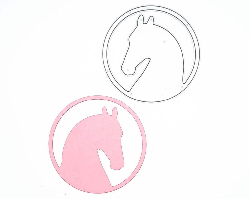 Ein Paar Stanzschablonen Pferd in rundem Rahmen, perfekt für Scrapbooking-Enthusiasten, auf einer weißen Oberfläche.