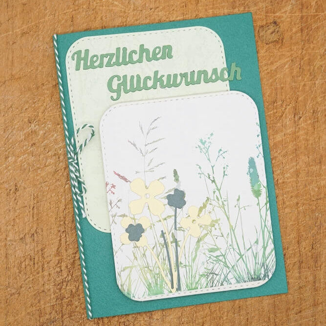 Die Stanzschablone "Sechs Rahmen mit runden Ecken" von Stanzenshop.de eignet sich ideal für handgemachte Karten im floralen Design mit dem deutschen Schriftzug "Herzlichen Glückwunsch" und verleiht jedem Bastelprojekt das gewisse Etwas.