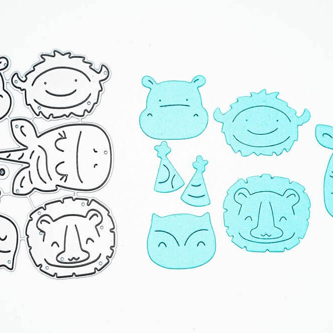 Das Stanzenshop.de Stanzschablone Set mit Nilpferd, Einhorn, Löwe, Eule und Bison erscheint links; rechts zeigen blaue Papiermotive die Tiere - ideal für Scrapbooking oder Basteln.