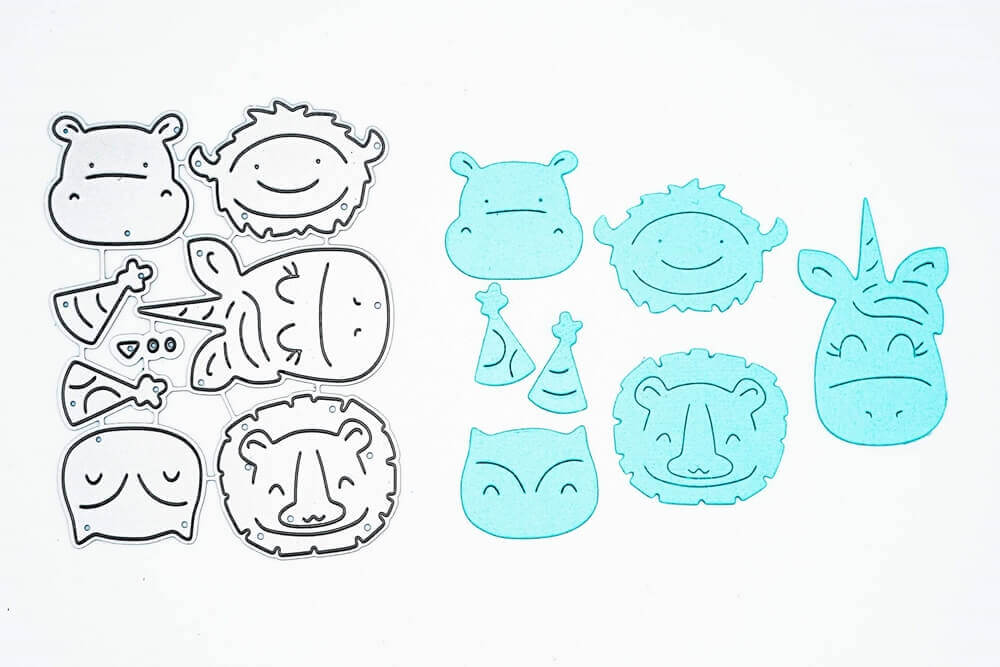 Das Stanzenshop.de Stanzschablone Set mit Nilpferd, Einhorn, Löwe, Eule und Bison erscheint links; rechts zeigen blaue Papiermotive die Tiere - ideal für Scrapbooking oder Basteln.