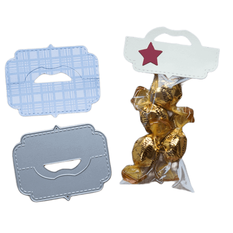 Drei rechteckige Stanzenshop.de Stanzschablone Verschluss für Tüten: ein roter Stern als Topper auf einer Bonbontüte sowie blau gemusterte und graue Designs - ideal für Basteln und kreative Verpackungen.