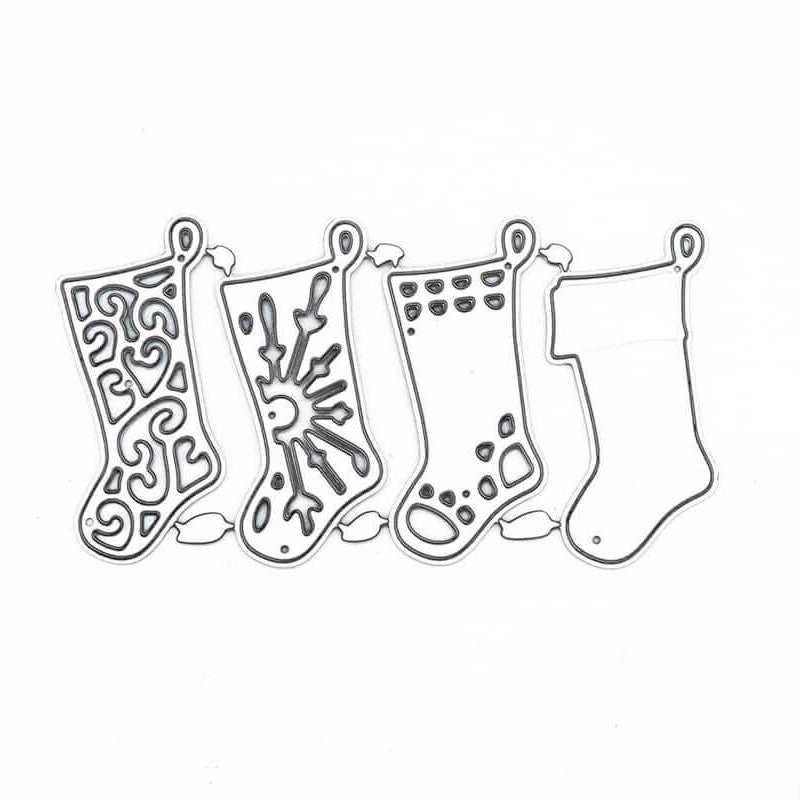 Die "Stanzschablone: Vier Socken" von Stanzenshop.de zeigt vier weihnachtliche Strumpfkonturen - Wirbel, Schneeflocken, Punkte und einfarbig - ideal für Basteln Weihnachten oder Scrapbooking, alle in einer Reihe auf weißem Hintergrund angeordnet.