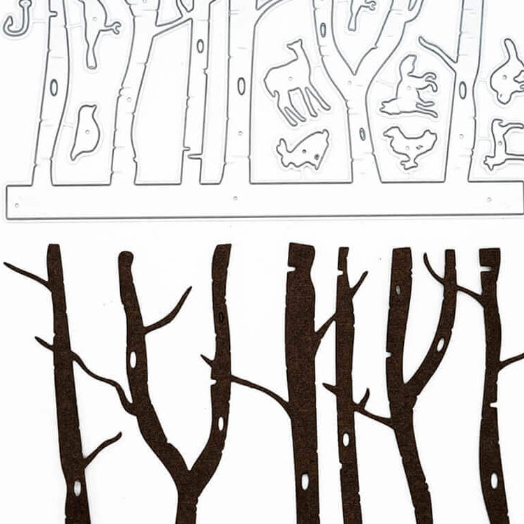 Die Stanzschablone Wald mit Tieren von Stanzenshop.de enthält Metallstanzteile von Bäumen und Waldtieren - ideal für charmante Scrapbooking- oder Bastelprojekte.