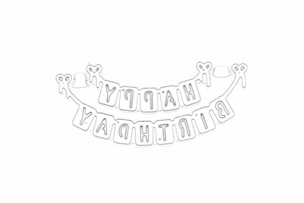 Die Stanzschablone Wimpelkette Happy Birthday von Stanzenshop.de zeigt "HAPPY BIRTHDAY" auf dem Kopf stehend, jedes Wort zwischen zwei Schleifen aufgereiht.
