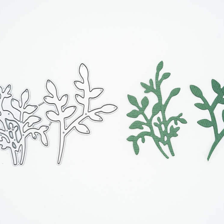 Auf der linken Seite sind zwei Metallstempel "Stanzschablone: Zwei Eukalyptus Sträuche" von Stanzenshop.de und auf der rechten Seite passende grüne Stanzteile, die sich perfekt für Scrapbooking oder Basteln eignen, alles auf weißem Hintergrund.