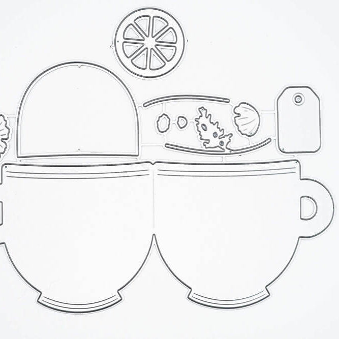 Umrisszeichnung von zwei Tassen nebeneinander mit Teezubehör oben, wie Zitronenscheibe und Anhänger-ideal als Stanzschablone Zwei Tassen mit Zubehör von Stanzenshop.de für Basteln und kreative Projekte.