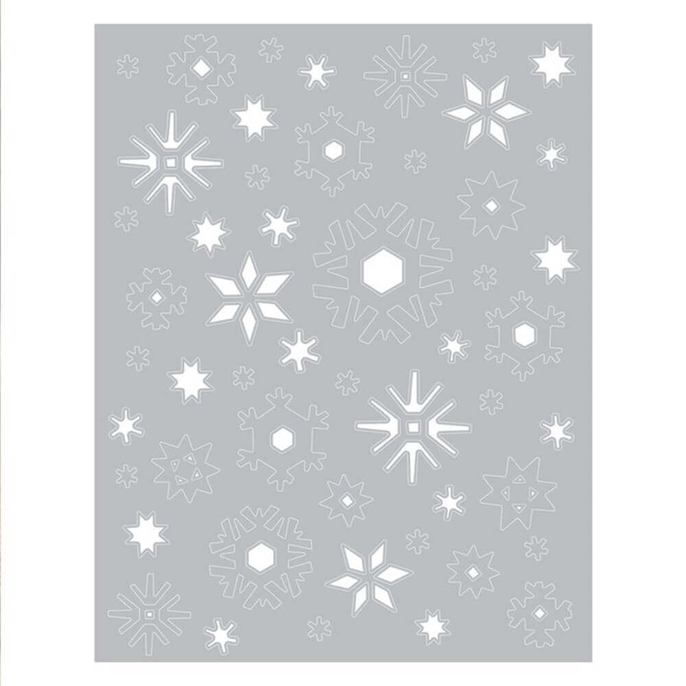 Weiße Schneeflocken auf grauem Hintergrund erstellt mit den Stanzen Die Arktis von Tim Holtz von Sizzix.