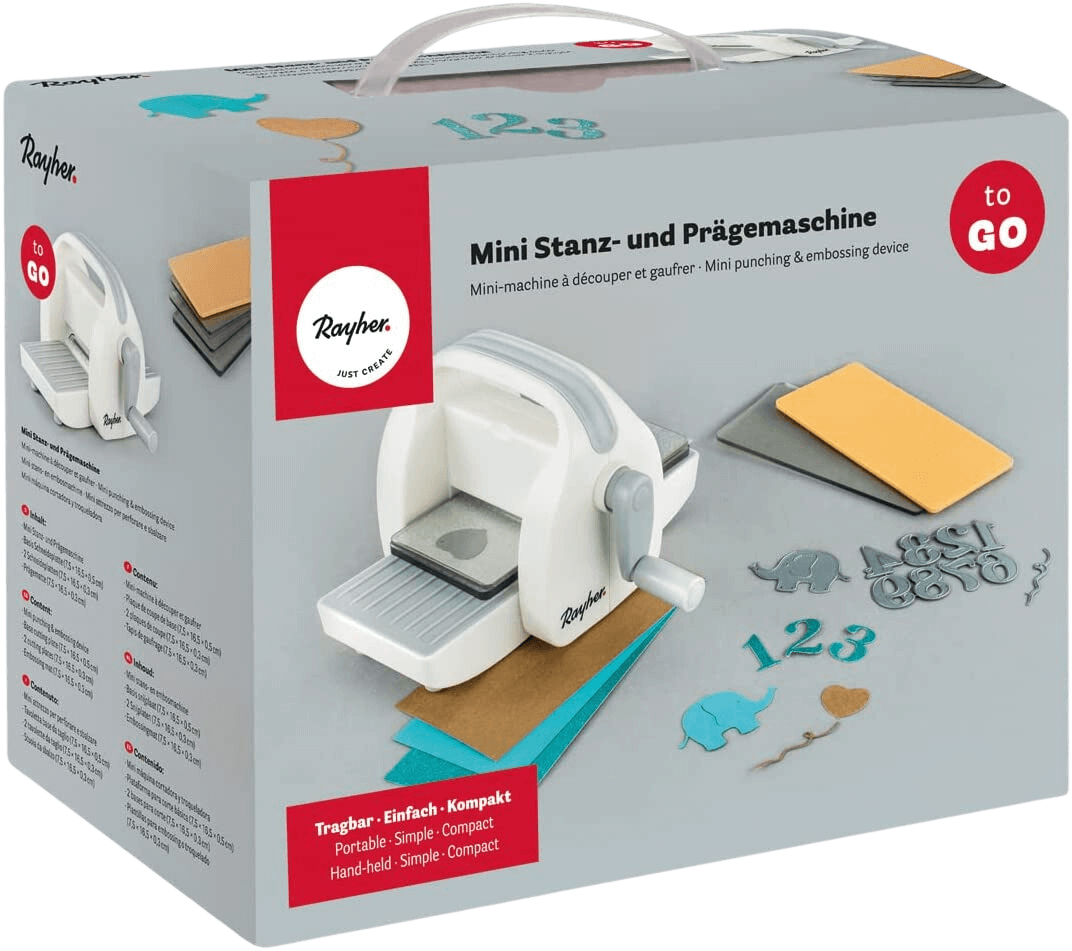 Rayher Mini-Stanz- und Prägegerät in einer Schachtel mit den auf der Verpackung abgebildeten Beispielen für gestanzte Papierformen und Stempel.