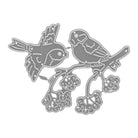 Die Stanzschablone Zwei Vögel mit einem Ast von Stanzenshop.de zeigt zwei filigrane Vögel auf einem blumigen Ast - ideal zum Scrapbooking & Basteln. Feine Details an Flügeln, Körpern und Blüten für kreative Projekte.