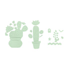 Drei flache, grüne Kaktusformen, die mit dem Stanzschablone Kakteenset von Stanzenshop.de erstellt wurden, plus zusätzliche dekorative Pflanzen - perfekte Akzente für Scrapbooking - auf weißem Hintergrund arrangiert.