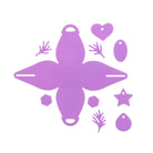 Flaches Layout von lila gestanzten Formen aus der Stanzschablone Schmuckkästchen von Stanzenshop.de, einschließlich einer Schachtelvorlage, zwei Händen, Ovalen, einem Herz, Stern und Sechsecken auf weißem Hintergrund.