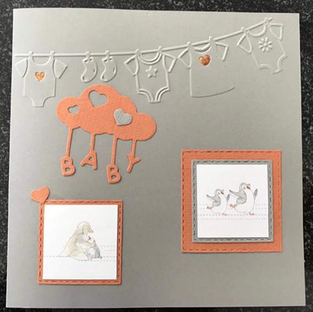 Handgefertigte Baby-Grußkarte mit ausgeschnittenen Illustrationen und dekorativen Elementen im Stanzenshop.de-Stanzschablone: Wolke mit Buchstaben „Baby“.