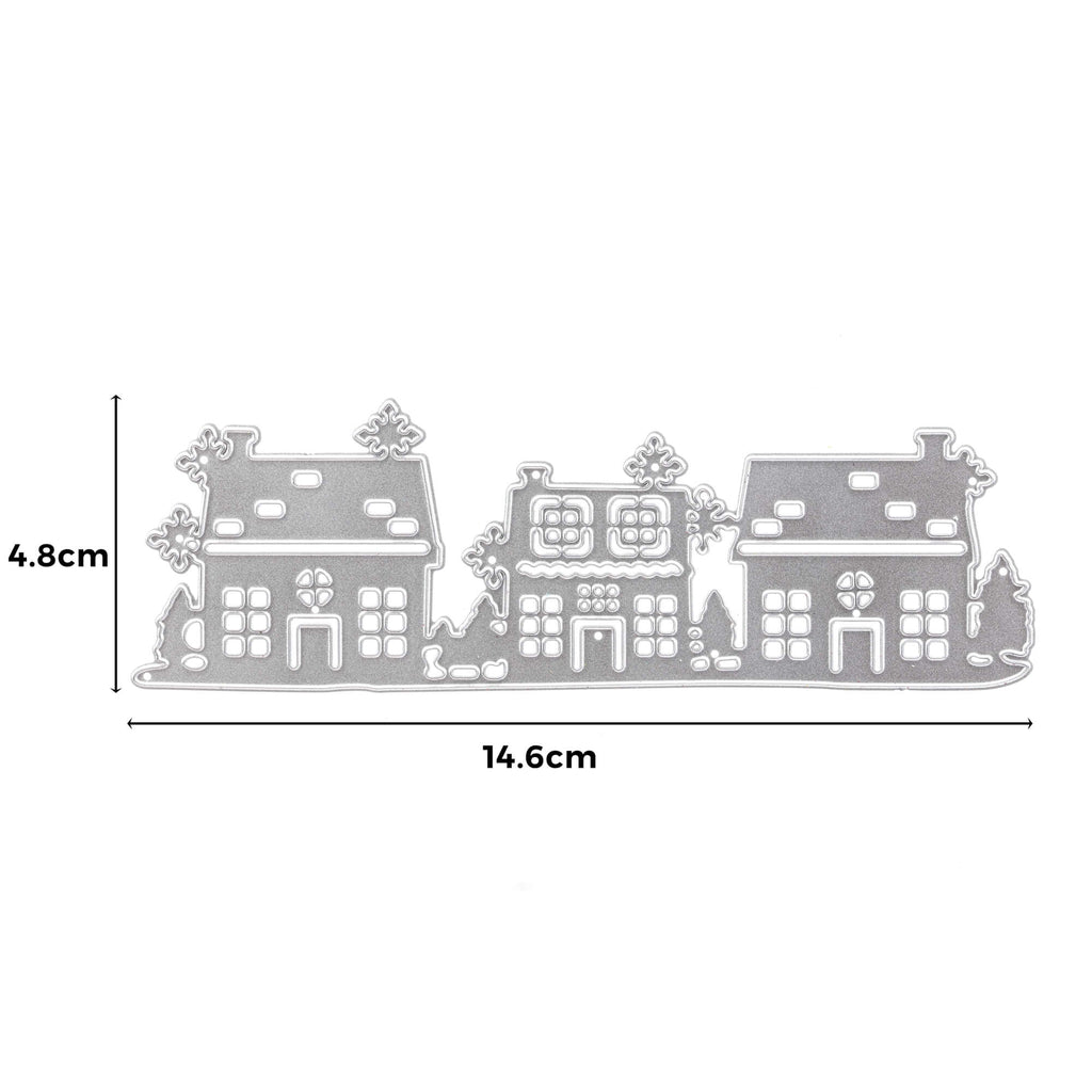 Ein kreatives Bild einer Häuserreihe mit Schnee und Bäumen, mit der Stanzschablone: Häuserreihe-Technik von Stanzenshop.de.