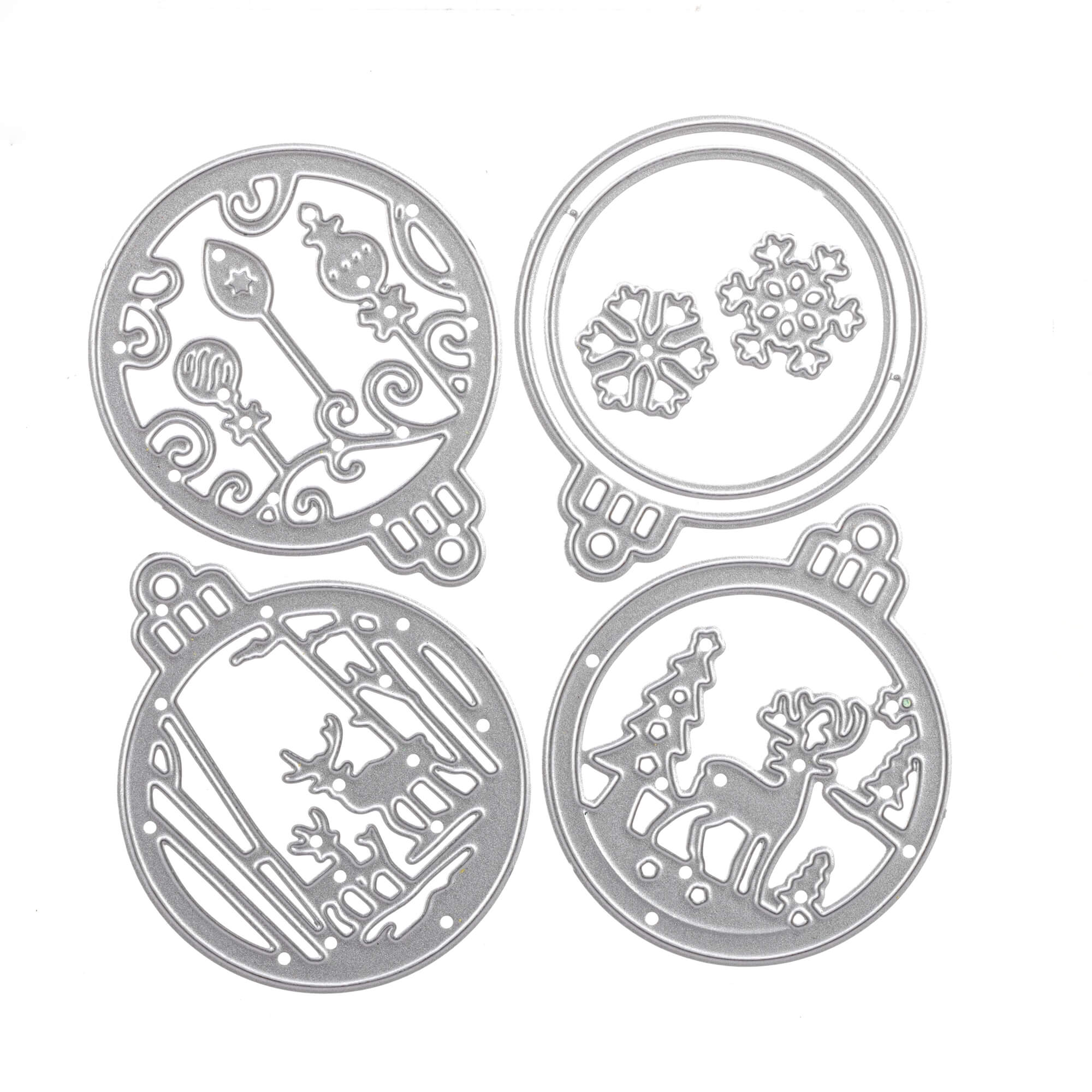 Set mit vier runden, silbernen, gestanzten Ornamenten aus der Stanzschablone von Stanzenshop.de: Kleine Christkugeln mit weihnachtlichen Motiven - Schneeflocken, Straßenlaternen und Rentiere mit Bäumen - eignen sich ideal für eine bezaubernde Weihnachtsdekoration.