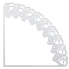 Die "Stanzschablone: Schultüte" von Stanzenshop.de ist eine silberne Metall-Eckschablone mit überlappenden Herzmustern, ideales Bastelzubehör für kreative Schultüten gestalten.