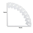 Die Stanzenshop.de Stanzschablone: Schultüte ist eine silberne Metall-Eckschablone mit Herzausschnitten, 14 cm pro Seite-perfektes Bastelzubehör zum Verzieren von Schultüten, dargestellt auf weißem Hintergrund.