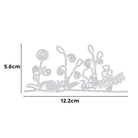 Die Stanzenshop.de Stanzschablone: Blumen mit Schnecken ist eine Metallstanze mit skurrilen Pflanzen und Blumen, mit den Maßen 5,6 x 12,2 cm - ideal für Bastelprojekte und eine perfekte Ergänzung für jede Stanzschablonen Blumen Kollektion. Abgebildet auf weißem Hintergrund mit Abmessungen.