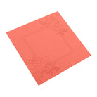 Mit dem Embossing Folder - Blumenrahmen für deine Karten von Stanzenshop.de entsteht eine quadratische Grußkarte in Koralle mit geprägten Blumen in zwei Ecken und einem schlichten quadratischen Rand in der Mitte.