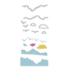 Die Stanzschablone Wolken & Vögel im Flug von Stanzenshop.de ist ein Set von Metallstanzformen, die sich perfekt für Scrapbooking eignen, hier mit bunten Papierausschnitten in Blau, Gelb und Rosa.