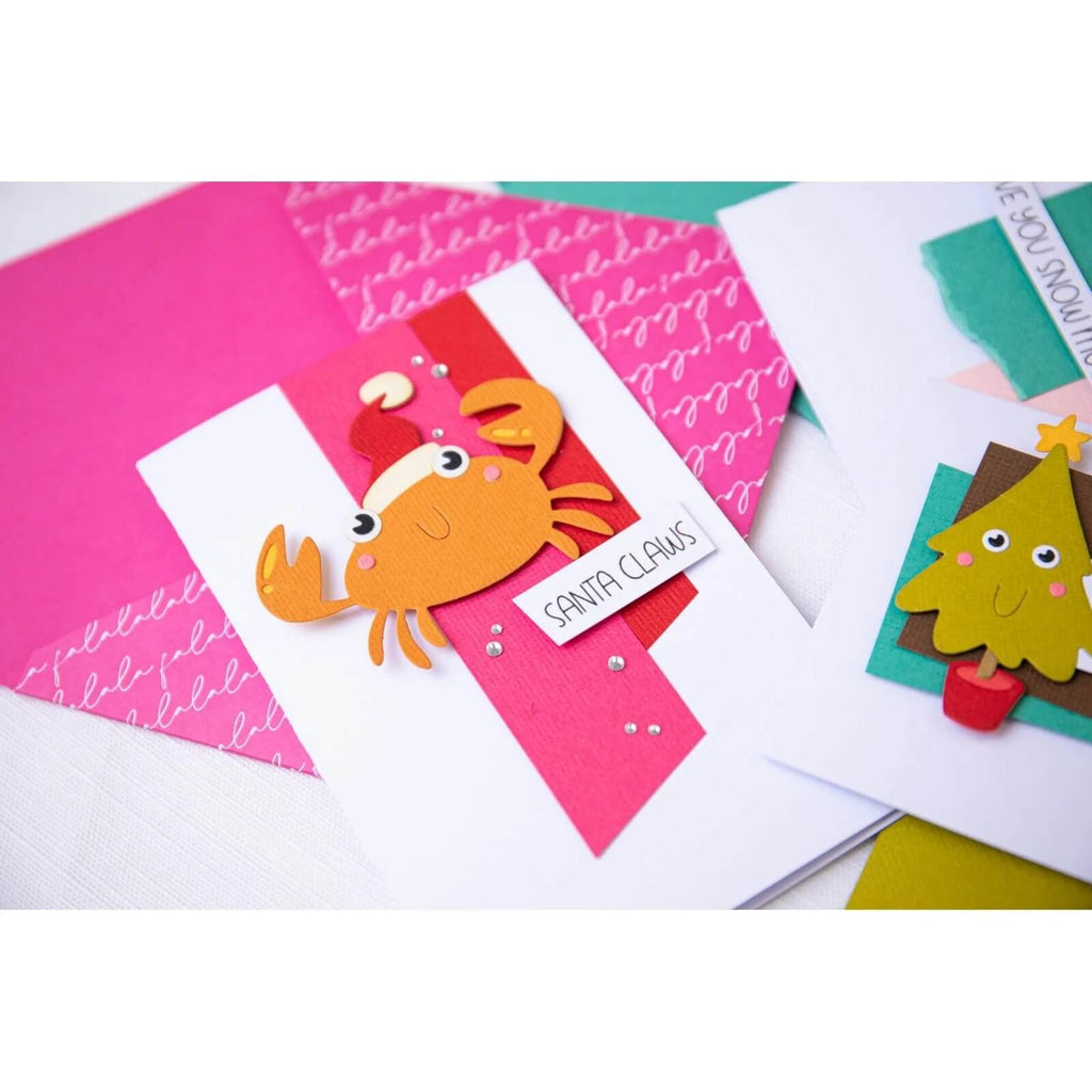 Ein Satz Sizzix Thinlits Die Set with Stamps Christmas Characters-Karten, perfekt für Thinlits- und Papierbastelprojekte.