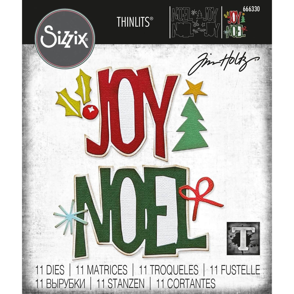 Eine Sizzix-Weihnachtskarte mit den Worten „Joy“ und „Noel“, umgeben von Bäumen.