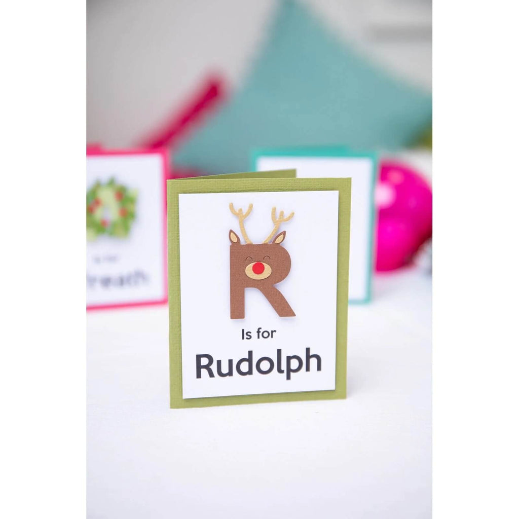 Ein Satz Sizzix • Thinlits Stanzformen-Weihnachtskarten mit dem Wort Rudolph.