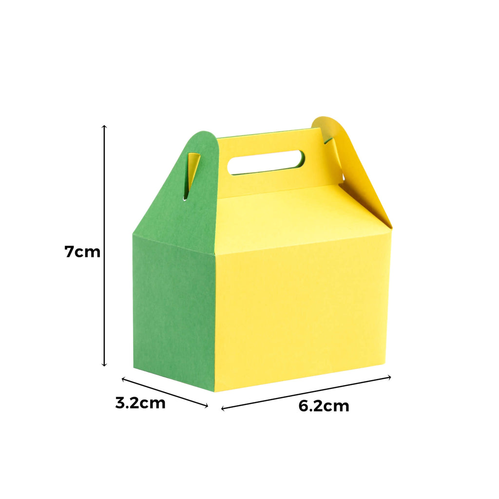 Eine gelb-grüne Papierschachtel mit Henkel, perfekt als Stanzschablone Große Schachtel von Stanzenshop.de.