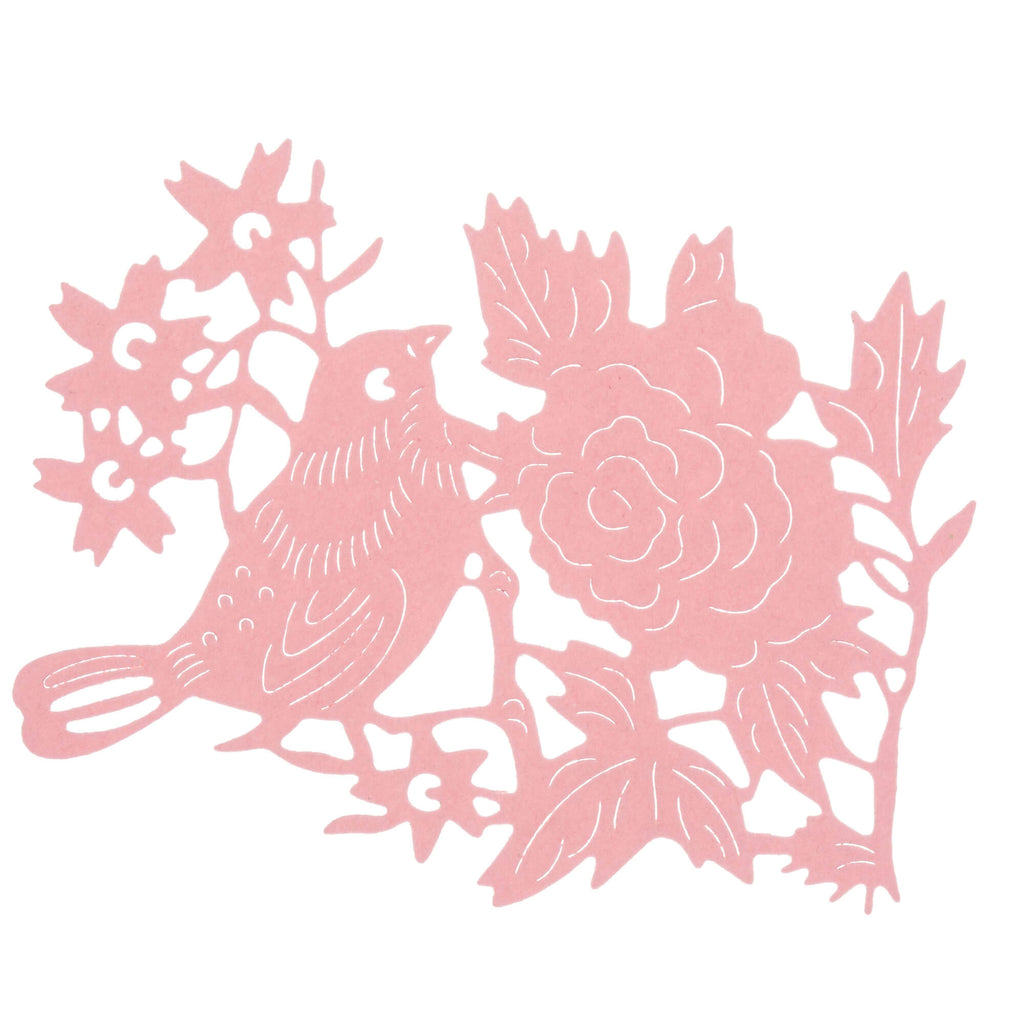 Eine rosa Stanzschablone: Vogel auf einem Ast mit Blüten, ausgeschnitten aus einem Vogel und Blumen, gekauft bei Stanzenshop.de.