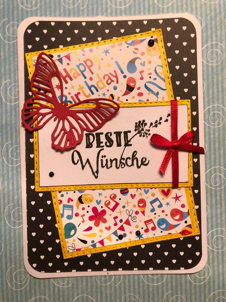 Eine Stanzenshop.de-Geburtstagskarte mit Schmetterlingsmotiv und verspielten Punkten.