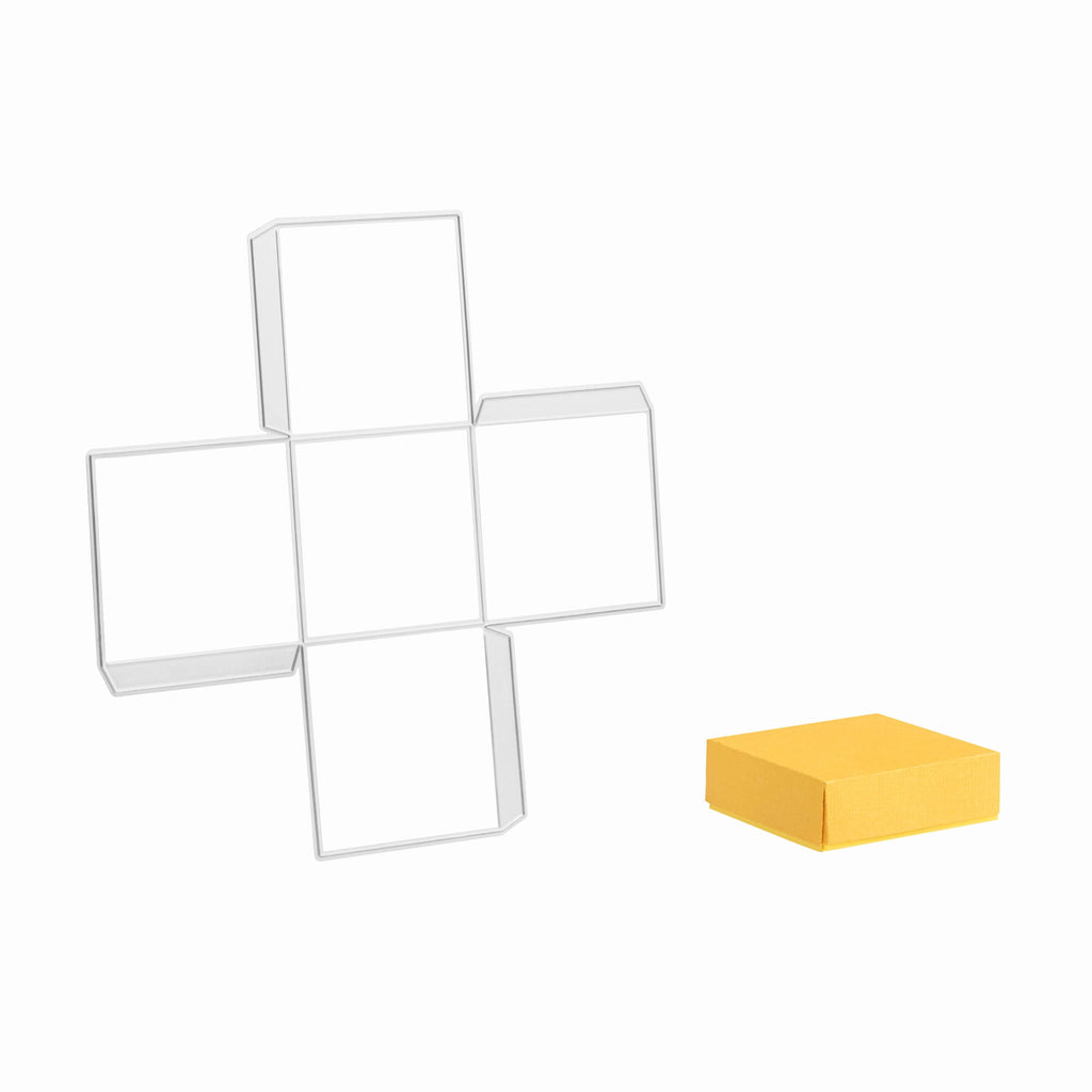 Eine weiße Stanzschablone Quadratische Box mit einem gelben Quadrat daneben von Stanzenshop.de.