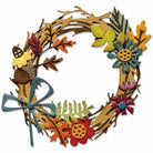 Das Sizzix 666682 - Thinlits Die Vault Foliage Wreath (14tlg.) Set von Sizzix kreiert dekorative Kränze mit bunten Papierblumen, Blättern, einer Eichel und einer blauen Schleife - perfekt für Papierbastelprojekte.