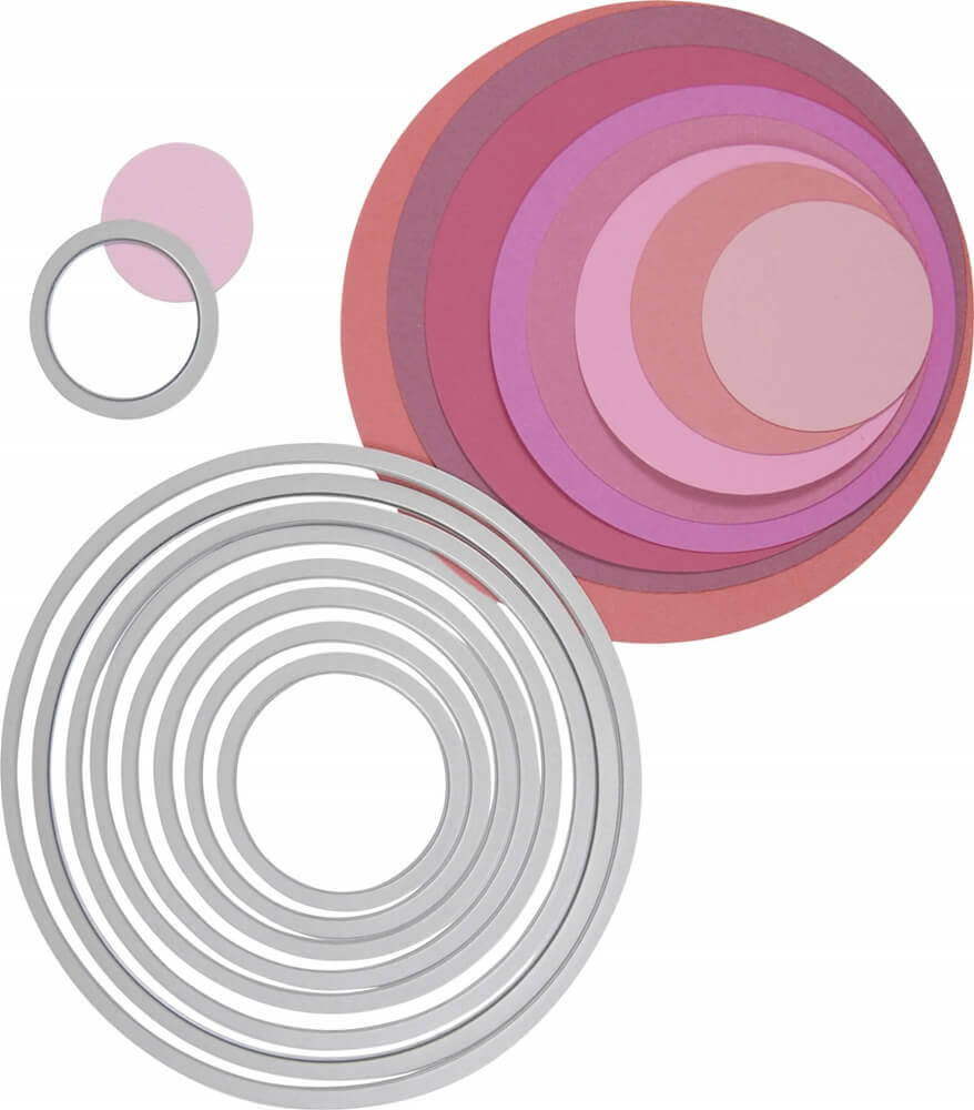 Ein Satz Sizzix Stanzformen-Set Framelits(TM) „Circles“ Ø 3 - 10,7 cm rosa und lila Kreise und Ringe.
