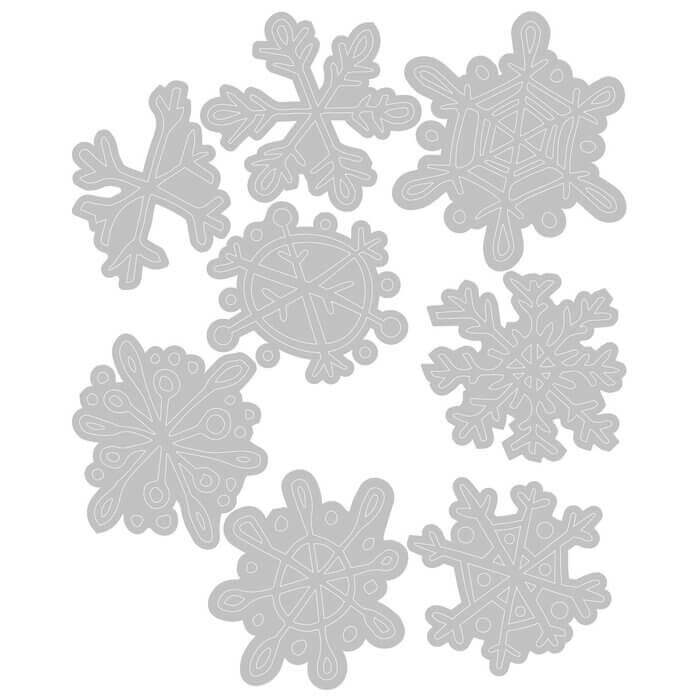 Ein Sizzix Thinlits-Set mit gekritzelten Schneeflocken auf weißem Hintergrund.