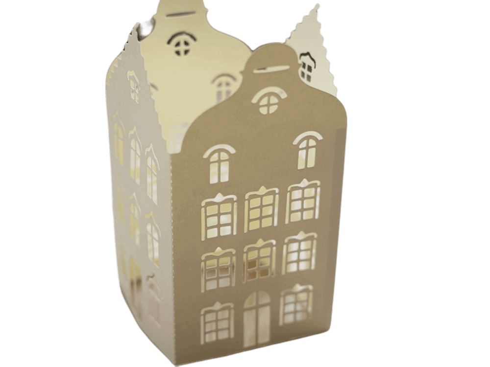 Eine goldene Pappschachtel mit einer Stanzschablone: Aufsteller in Gebäudeform von Stanzenshop.de darauf.