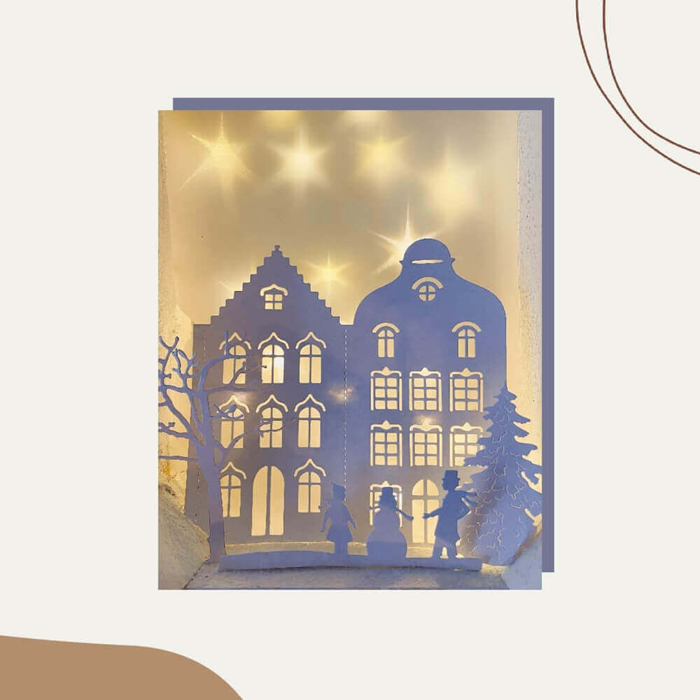 Eine Weihnachtskarte von Stanzenshop.de mit der Silhouette eines Mannes und einer Frau.