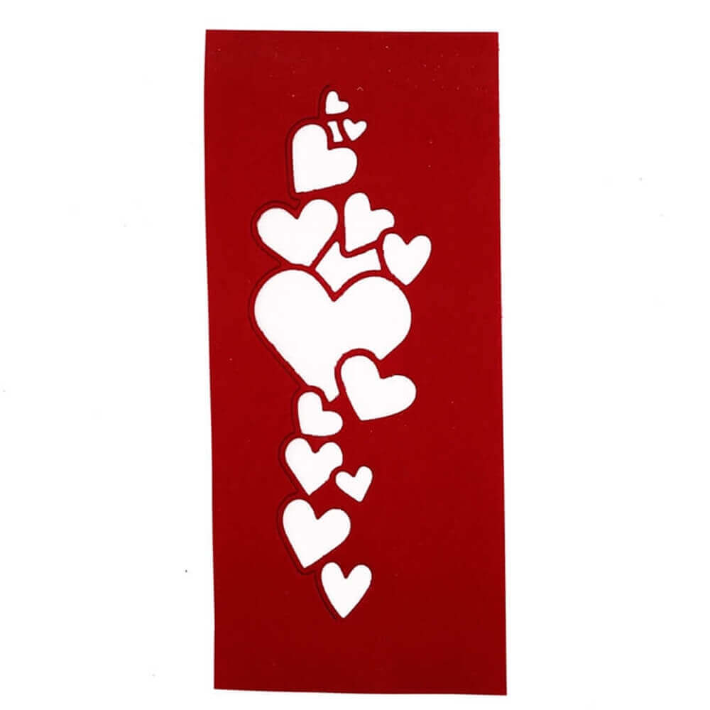 Eine rote Karte mit weißen Herzen darauf, erstellt mit einer Stanzschablone Band aus Herzen von Stanzenshop.de.