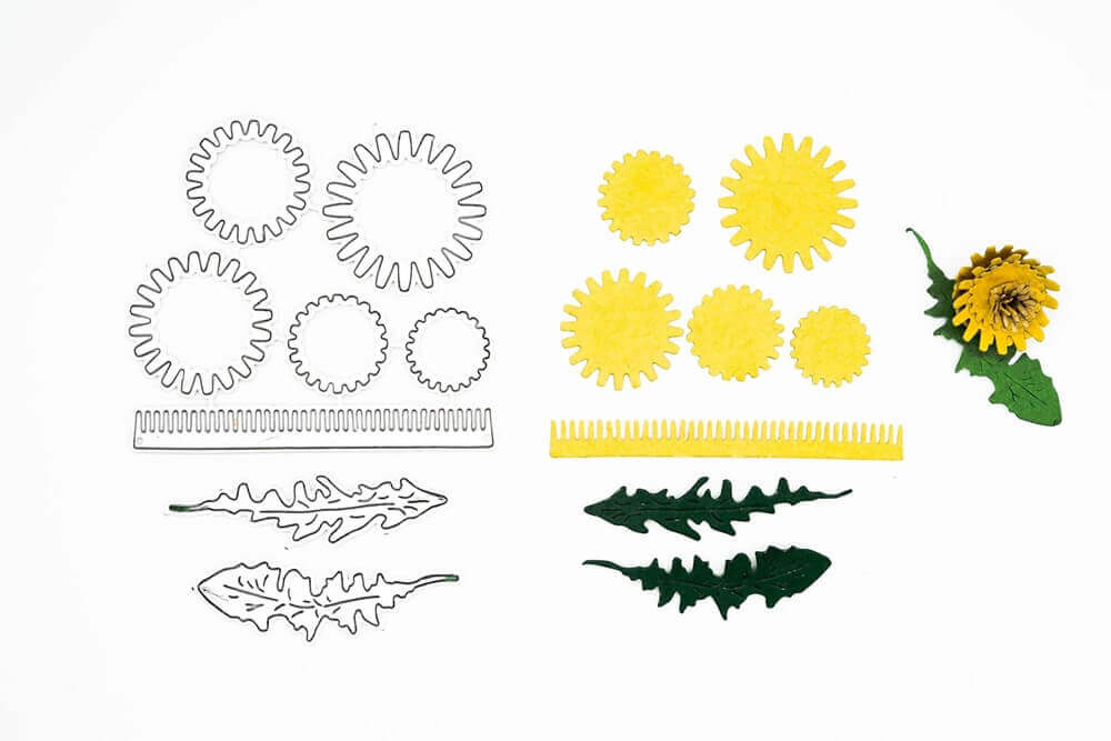 Mit der Stanzschablone Bastelset Löwenzahn von Stanzenshop.de - ideal für Scrapbooking-Projekte - lassen sich Stanzformen aus Metall und passende gelb-grüne Papierausschnitte, die als Teile einer Pusteblume auf Weiß angeordnet sind, perfekt in Szene setzen.