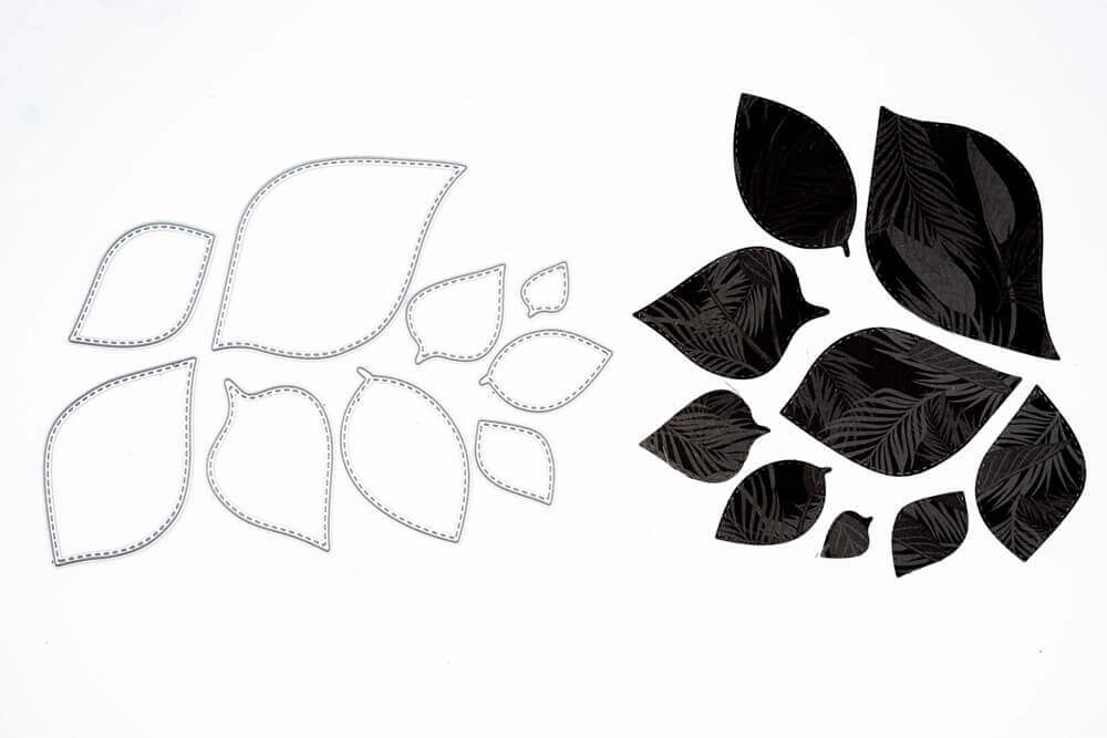 Auf der linken Seite sind neun "Stanzschablone: Blätter in verschiedenen Größen" von Stanzenshop.de, mit passenden schwarzen blattförmigen Ausschnitten auf der rechten Seite - ideal zum Basteln und für kreative Projekte.