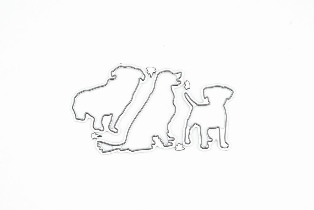 Die Stanzschablone Drei Hunde von Stanzenshop.de zeigt drei Metallstempel in verschiedenen Hundeformen, ideal zum Basteln und Backen, elegant auf weißem Hintergrund.