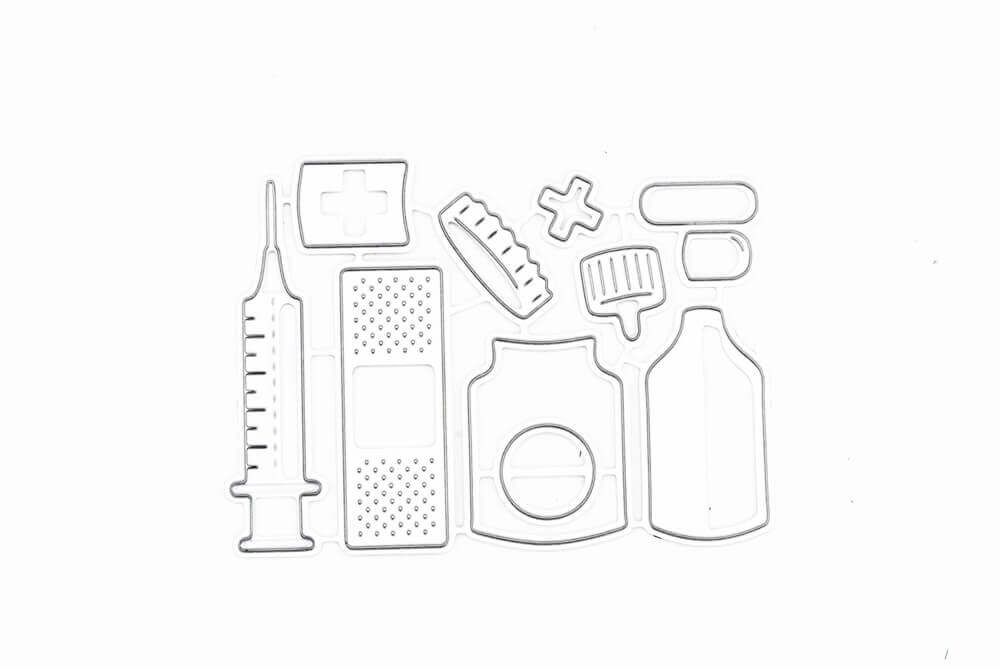 Eine Zeichnung verschiedener medizinischer Artikel der Marken Stanzschablone Erste Hilfe Set, Pflaster, Spritze und Medikamente auf weißem Hintergrund.
