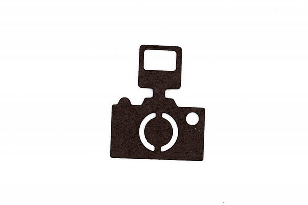 Die Stanzenshop.de Stanzschablone: Kamera mit Blitz zeigt einen schwarzen Ausschnitt einer Kamera mit Blitz auf weißem Hintergrund - ideal für Kartenherstellung oder Scrapbooking.