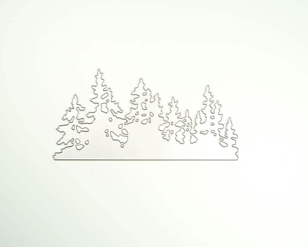 Ein weißes Blatt Papier mit der Stanzschablone: Landschaft aus Tannenbäumen von Stanzenshop.de darauf.