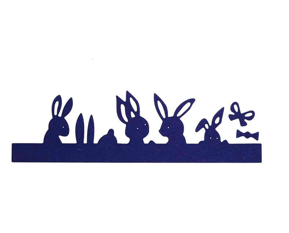 Eine Silhouette der Stanzschablone Reihe mit Hasen und Verzierungen von Stanzenshop.de auf blauem Hintergrund, erstellt aus hochwertigem Papier.